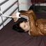Simone tied and gagged in shiny nylon rainwear