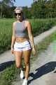 Watch Chloe enjoying her shiny nylon Shorts outside at a sunny Day