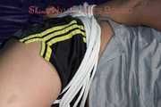 Pia being tied and gagged on a sofa with ropes and a cloth gag wearing a sexy shiny nylon shirts and a tshirt (Pics)