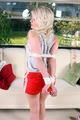 Nina tied and gagged in shiny red nylon shorts