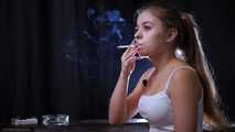 Lovely girl Irina enjoys the moment while smoking a cigarette