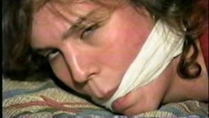 HEATHER GETS HOG-TIED, CLEAVE GAGGED & HANDGAGGED ON THE BED (D35-15)