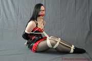 Bound in sexy PVC minidress and PVC gloves