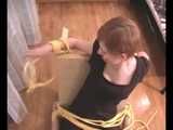 Alice Lee - Dress-wearing beauty gets tied to a table and escapes (video)