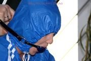 Jil tied and gagged in shiny nylon clothes