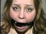 NAKED, BALL-TIED, TAPE AND RING-GAGGED CUTIE FACE HOLLY (D25-10)