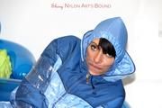 Simone tied and gagged in a shiny nylo skisuit