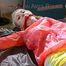 Mara tied and gagged with chains and cuffs on a bed wearing a superhot yellow shiny nylon shorts and an orange rain jacket (Pics)