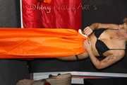 Watching Pia putting on a wonderful supersexy shiny nylon rainssuit in orange (Pics)