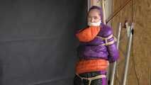 Rachel Adams bound, gagged and double hooded in shiny downjackets