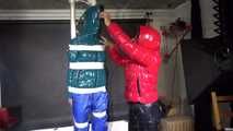 See Ronja tied, gagged and suspended by Stella, both wearing shiny nylon Downwear