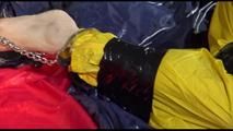 Sonja tied, gagged and hooded on bed with tape wearing a supersexy yellow rainwear combination (Video)