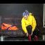 Sexy Mara trying on her new yellow down jacket and her lifevest in combination with a sexy shiny black rain pants and rubber boots (Video)