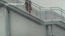 020167 Kathy Pees From A Staircase In The Snow