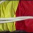 PIA tied and gagged with ropes on a sofa wearing a sexy red shiny nylon shorts and a yellow rain jacket (Video)