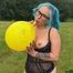 outdoor Blow2Pop topless yellow Q16 manga print with mouthpiece during rain 