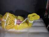 Watch Pia enjoying Bondage in her shiny nylon yellow Rainwear