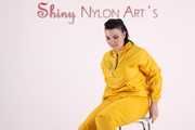 Watching sexy Jill wearing a sexy yellow shiny nylon rainwearcombination and a red shiny nylon raincoat posing for you (Pics)