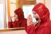 Jill ties, gagges and hoodes herself in front of a mirror and in an strairway wearing a sexy shiny nylon rain pants in black and a red rain jacket (Pics)