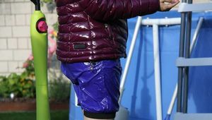 Watch Chloe enjoying the Summer in the Garden her shiny nylon Downjacket