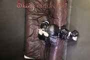 Sexy Courtney being tied and gagged with tape on a bed wearing black rainwear (Pics)