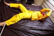 Pia tied and gagged in a shiny nylon rainsuit 