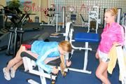 Katharina and Jenny during their workout in the fitness center wearing sexy shiny nylon shorts and rain jackets (Pics)