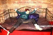 Mara tied and gagged on a princess bed in an old cellar wearing an supersexy shiny green down jacket and a rain pants (Pics)