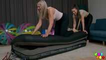 1434 Melly and Katja stress an air mattress
