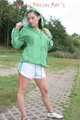 Watching ***OUR SEXY ARCHIVE MODEL JENNY*** wearing a sexy white shiny nylon shorts and a green shiny nylon rain jacket posing for you (Pics)