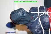 Get 548 Pictures with Jill tied and gagged in shiny nylon rainwear from 2005-2008!