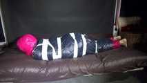 Sexy Sandra wearing sexy shiny nylon pink rain pants and a sexy shiny nylon down jacket being wrapped in a down cover tied and gagged with tape and a clothgag (Video)