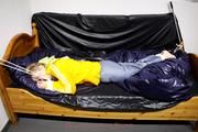 Samanthy bound and gagged in shiny nylon rainwear