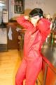 Jill posing sexy in an bar wearing sexy red shiny nylon rainwear (Pics)