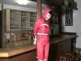 one of our archive girl tied and gagged in a shiny nylon rainsuit