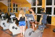 Stella and Leonie in a fitness studio doing theri workout wearing sexy shiny nylon shorts and tops (Pics)
