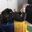 Archive girl tied and gagged wearing a shiny nylon rainwear (Video)