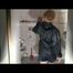 Blonde archive girl posing on a blowable chair wearing shiny nylon shorts and a rain jacket (Video)