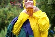 Jill Diamond in the garden playing with water out of the garden hose wearing supersexy shiny nylon rainwear and a rain cape (Pics)