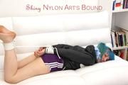 Mara tied and gagged on a white sofa in a reading lounge wearing a sexy purple shorts with shadow stripes and a black rain jacket (Pics)