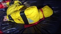 Sonja tied, gagged and hooded on bed with tape wearing a supersexy yellow rainwear combination (Video)