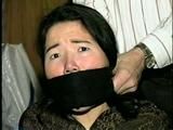 25 YEAR OLD ASIAN MAI-LING IS MOUTH STUFFED, CLEAVE GAGGED, HANDGAGGED, OTM GAGGED, TAPE GAGGED & TIGHTLY TIED TO A CHAIR  (D47-15)