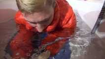 Watching SEXY SANDRA wearing a sexy lightblue oldschool shiny nylon shorts and an orange downjacket diving in the bathtub for a very special friend :-) (Video)