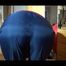 Watch Sonja to dress herself with rainwear and begin her workout on the home trainer (Video)