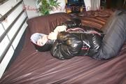 Jill ties, gagges and hoodes completely herself wearing a black rain pants and a black down jacket (Pics) 