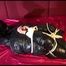 Lucy tied and gagged on a sofa wearing a sexy black rainwear combination (Video) 