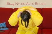 Jill ties, gagges and hoodes herself wearing a shiny yellow down jacket and a yellow rain pants(Pics)