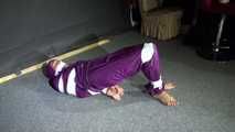 Sexy Sandra wearing a supersexy purple shiny nylon rainsuit bein tied and gagged and hooded on the floor with tape (Video)