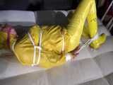 Watch Pia enjoying Bondage in her shiny nylon yellow Rainwear
