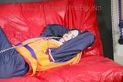 *** HOT HOT HOT*** NEW MODELL*** DESTINY wearing a sexy blue/red shiny nylon rain suit and a life jacket ties and gagges herself with cuffs on a sofa (Pics)